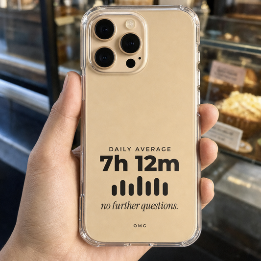 Clear iPhone case printed “Daily average 7h 12m, no further questions.” in black, held in a coffee queue
