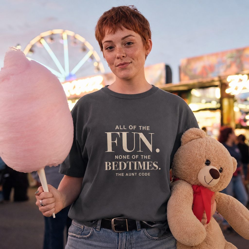 All of the Fun, None of the Bedtimes oversized tee worn at a funfair with candy floss and a prize teddy